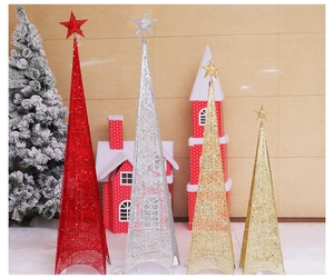 Detail of Christmas metal cone tree decorations with glitter wire and LED star toppers