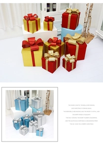 Detailed view of assorted Christmas gift boxes with glitter ribbons in various sizes
