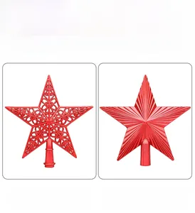 Detail view of two red Christmas tree topper stars with hollow and striped textures