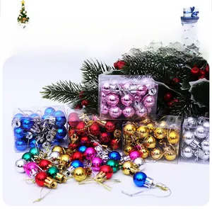 Macro detail of multi-colored mini Christmas balls in 2cm size with shiny plated finish