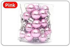 Pink electroplated mini Christmas ball ornaments in a transparent plastic storage box
