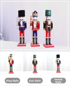 Three 38cm wooden Christmas nutcracker figures including king and soldier styles on white