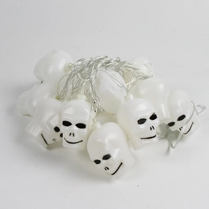 Halloween LED string lights featuring white skull lanterns for spooky party room decoration