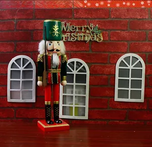 Detailed view of a 38cm wooden nutcracker soldier king with rifle and red base decor