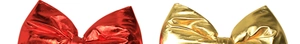 Detail showing shiny metallic red and gold bows with textured fabric for holiday decor