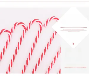 Close-up of classic red and white spiral candy cane ornaments for Christmas tree decor