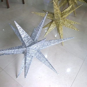 Three-dimensional Christmas star ornament with sparkling gold and silver glitter finish