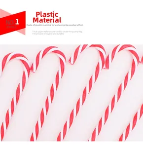 Detail view of 15cm red and white plastic candy cane ornaments for Christmas tree decor