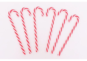 Detail of six red and white spiral candy cane ornaments for Christmas tree decoration