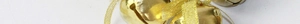 Close-up of shiny golden Christmas bells with glittery ribbons for tree decoration