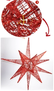 Macro detail of red woven 14-point star ornament with glitter finish for Christmas decor