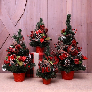 Set of four mini Christmas trees with HO decor, red berries, and plaid ribbons in red pots