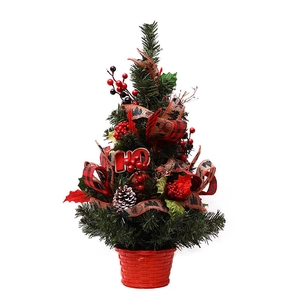 Mini tabletop Christmas tree with red berries, pine cones and HO sign in a basket