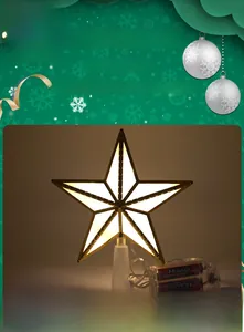 Detail of LED Christmas tree star topper with golden frame and external battery pack