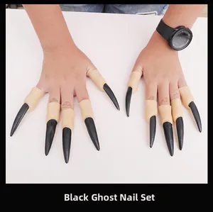 Close-up of Halloween ghost finger nails props with black sharp tips and flesh-colored base