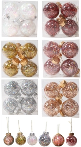 Detailed view of clear Christmas balls with internal colorful laser tinsel in a square gift box