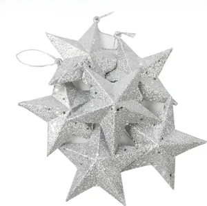 Detail of silver glitter star ornaments for Christmas tree with silver hanging strings