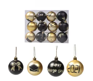 Detail of black and gold graduation Christmas balls with Happy College Grad and glitter design