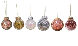 Detail of transparent PET Christmas balls with colorful laser tinsel fill and gold hanging strings