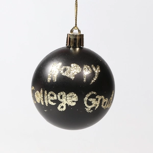 Matte black Christmas ball with golden Happy College Grad text and gold hanging string