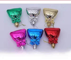 Detail view of colorful plastic Christmas tree gift bag ornaments with shiny electroplating