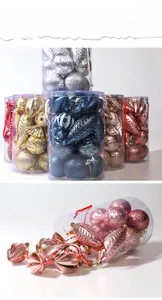 Detailed close-up of mixed Christmas ornaments with glitter and embossed finishes