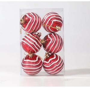 Close-up of 6pcs red and white Christmas balls with wave pattern in clear box