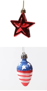 Close-up of star and teardrop Christmas ornaments with American flag and red star designs