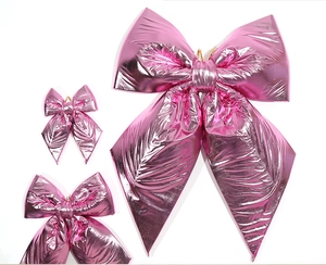 Lot de trois nœuds métalliques roses brillants en tailles grande, moyenne et petite déco