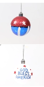 Macro shot of God Bless America white bauble and American flag pattern Christmas ornament