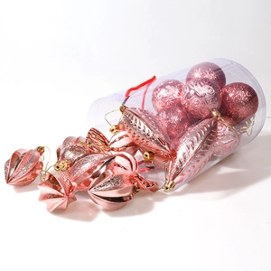 Rose gold Christmas ornament set with textured baubles and finials in a clear tube
