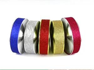 Detail of five glitter ribbons in blue, silver, red, gold and rose for Christmas DIY