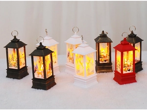 Detail of Christmas lantern decorations with reindeer patterns and warm LED light effect