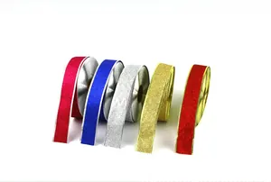 Macro shot of glitter Christmas ribbon set in five sparkling colors for gift wrapping