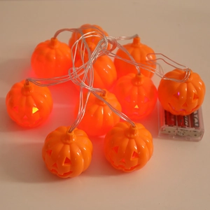 Halloween pumpkin string lights with orange Jack-o'-lantern LED bulbs and battery pack