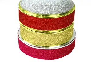 Close-up of sparkling sequin ribbons in silver red gold and pink for Christmas bows