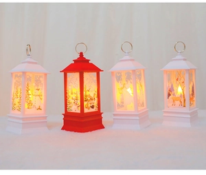 Close-up of portable Christmas lanterns with festive Santa and snowman patterns