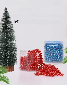Macro detail of red and blue metallic Christmas bead chains in transparent storage jars