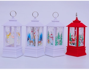 Detailed close-up of four Christmas lanterns featuring angel, reindeer, and snowman designs