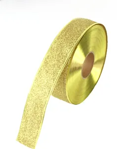 Macro shot of 5cm wide golden glitter ribbon roll for Christmas DIY bow decoration