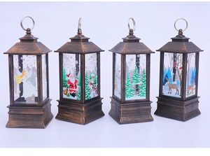 Detail view of four bronze Christmas lanterns with angel and Santa Claus illustrations