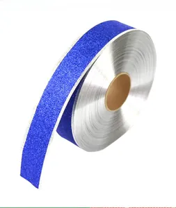 Detailed view of royal blue sequin ribbon roll with silver edges for holiday DIY crafts