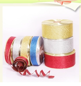 Glitter Christmas ribbons in gold silver red and blue for festive tree decoration