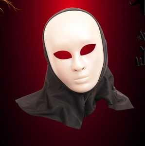 Detailed macro view of a white plastic Halloween mask with an integrated black fabric hood