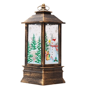 Vintage bronze Christmas lantern with festive snowman and tree scene for holiday decor