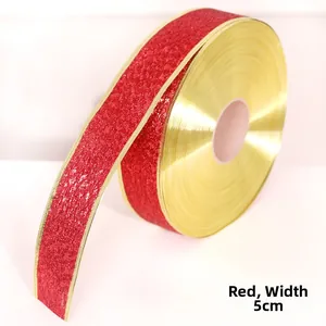Close-up of 5cm wide red glitter ribbon with gold edges for Christmas tree decoration