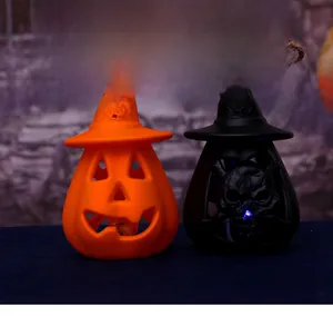 Detail of Halloween pumpkin and skull lanterns with wizard hats and hanging ropes