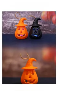 Detail of Halloween pumpkin lantern with wizard hat design and hanging jute rope