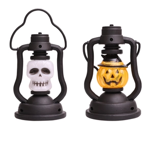 Detail view of portable Halloween LED lanterns featuring skull and pumpkin jack-o-lantern designs