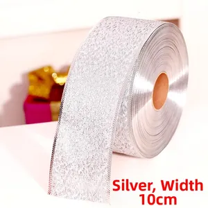 Detail of 10cm wide silver glitter ribbon roll for Christmas tree and gift decoration